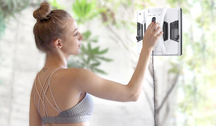 Robot window cleaner in action on a large glass surface